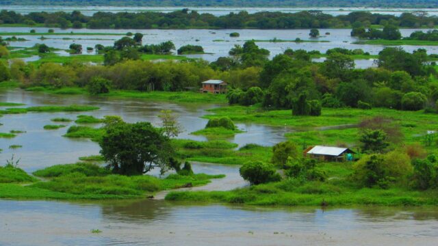 Flood plains with houses dotted around