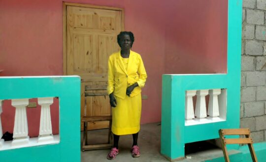 Haiti Earthquake Response - woman posing with new home