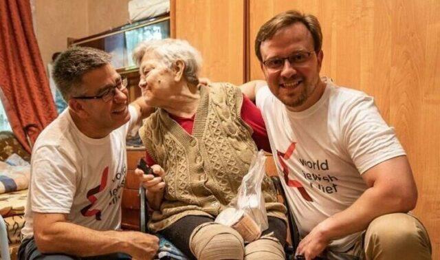 World Jewish Relief CEO and Partner Dreamland helping a disabled woman in Ukraine